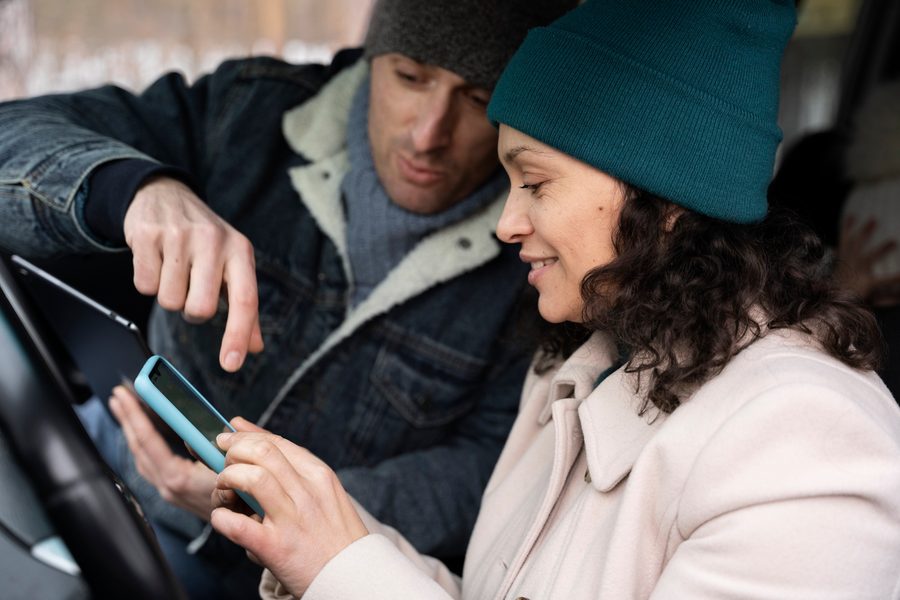Smartphone displaying fintech remittance app with fee comparison screen