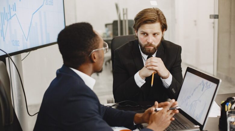 Person on phone negotiating lower interest rate with lender