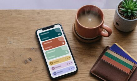 Stacked fintech debit cards showing rewards earning potential across multiple platforms