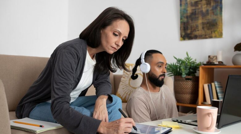 Stay-at-home parent reviewing financial projections on a laptop using AI planning software
