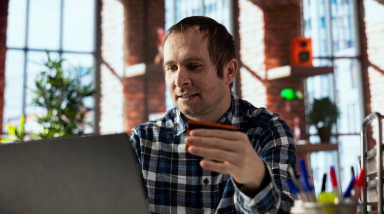 Iowa farmer reviewing payment settlement data on tablet connected to cloud-based AI payment routing system