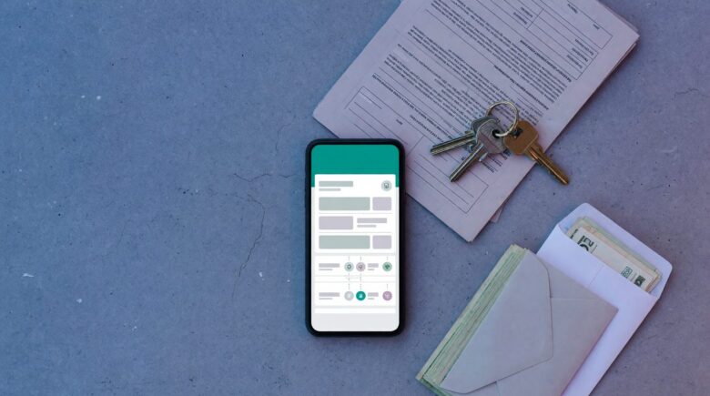 Roommates using a bill-splitting app on smartphone to track shared rent and expenses