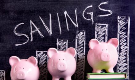 A person reviewing a list of high-yield savings options for building a smart money buffer
