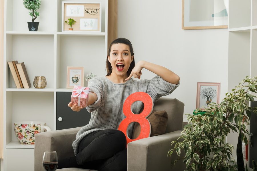 Scale balancing a paycheck against a rising line of expenses