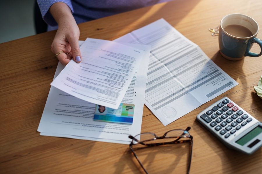 Nurse looking at retirement bridge spreadsheet with 457(b) column highlighted
