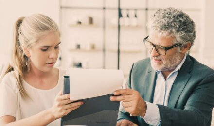 Professional reviewing financial recovery plan after divorce with savings targets and automated transfer setup