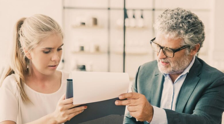 Professional reviewing financial recovery plan after divorce with savings targets and automated transfer setup