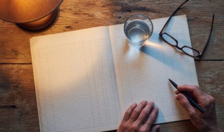 Older couple reviewing retirement finances at home with concern