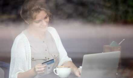 Young adults using fintech apps on smartphone to build emergency savings in Texas and Florida