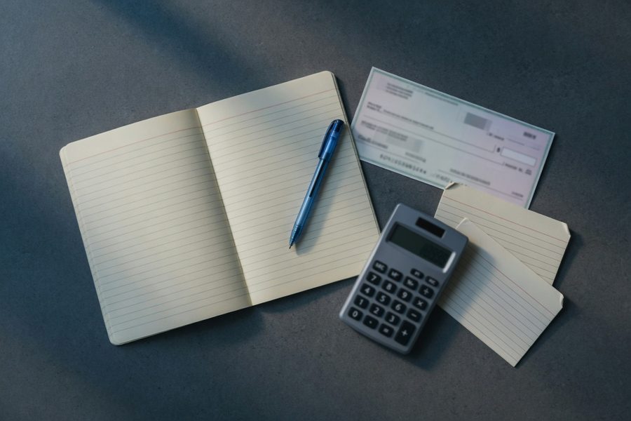 A checklist on a smartphone screen walks through eight budgeting decision steps.