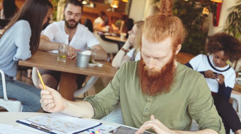 Small business owner in Austin using AI bookkeeping tools to manage finances
