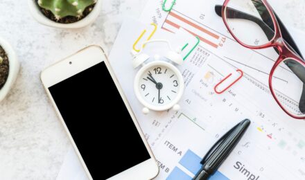 Gig worker reviewing earnings data on mobile device with AI-powered dashboard